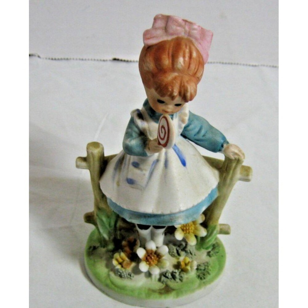 RaRe LEFTON Girl Fence EATING a LOLLIPOP  Flowers Figurine